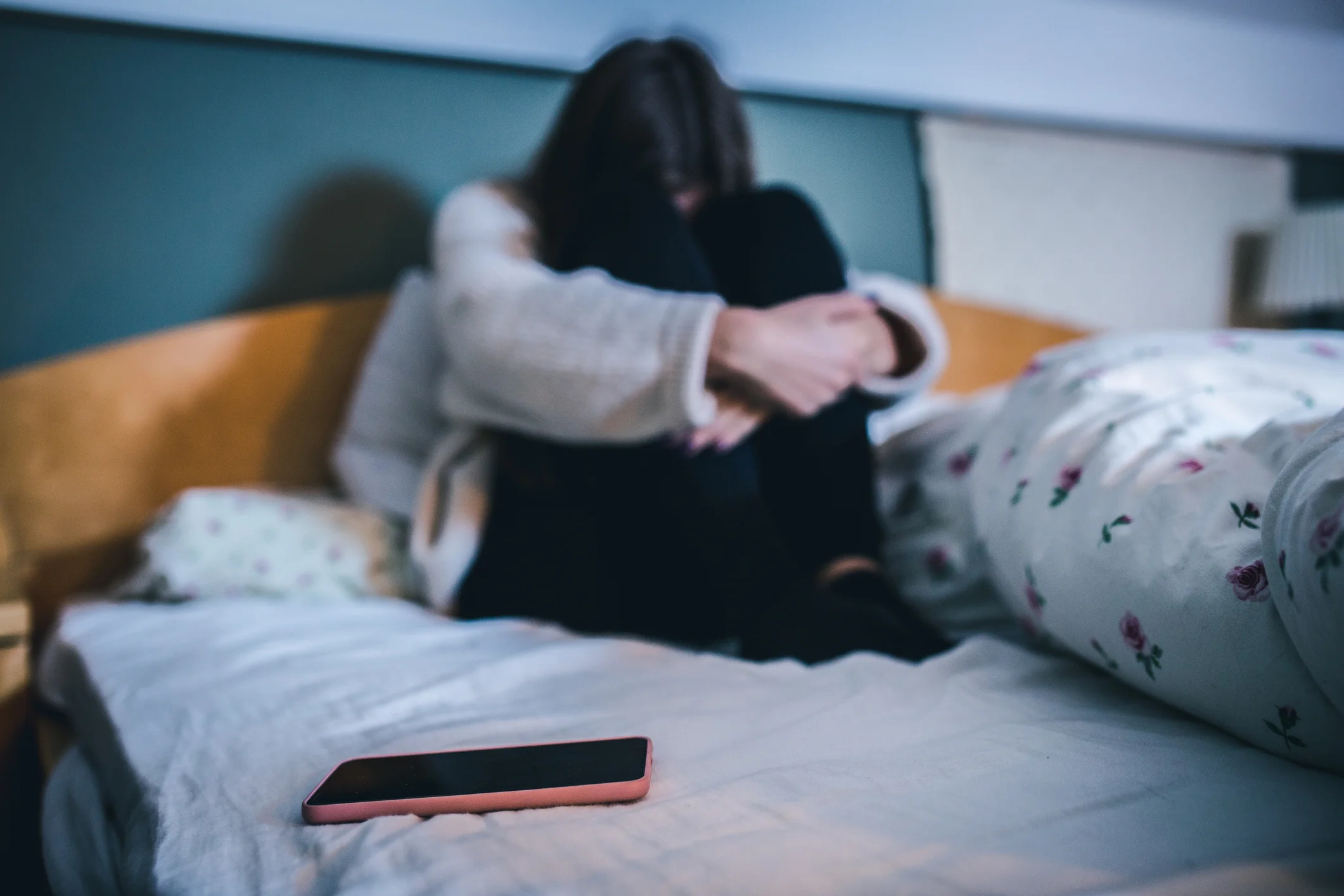 A young person offering comfort and support to a struggling teen